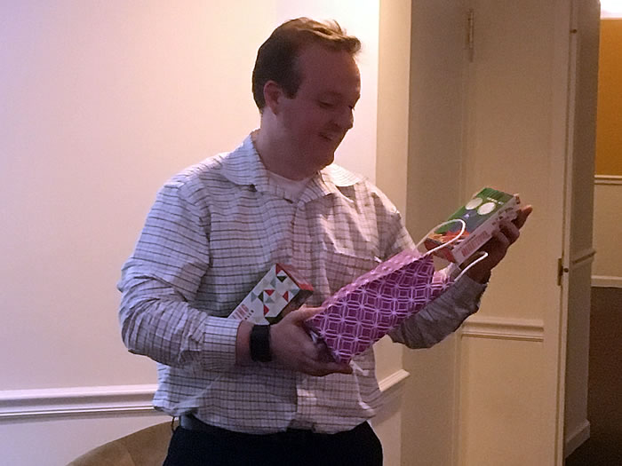 Taylor Kingsbury opening his white elephant gift