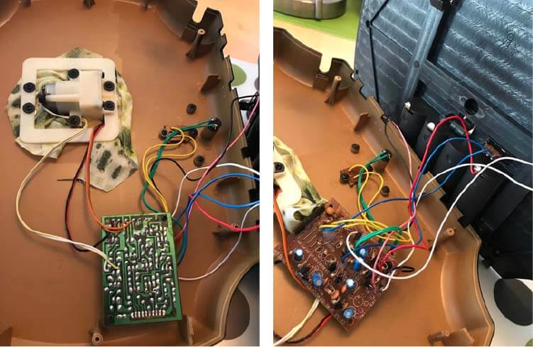 Inside of the Billy Bass which shows the controller unit wired to the motors, speaker, motion sensor, and battery compartment