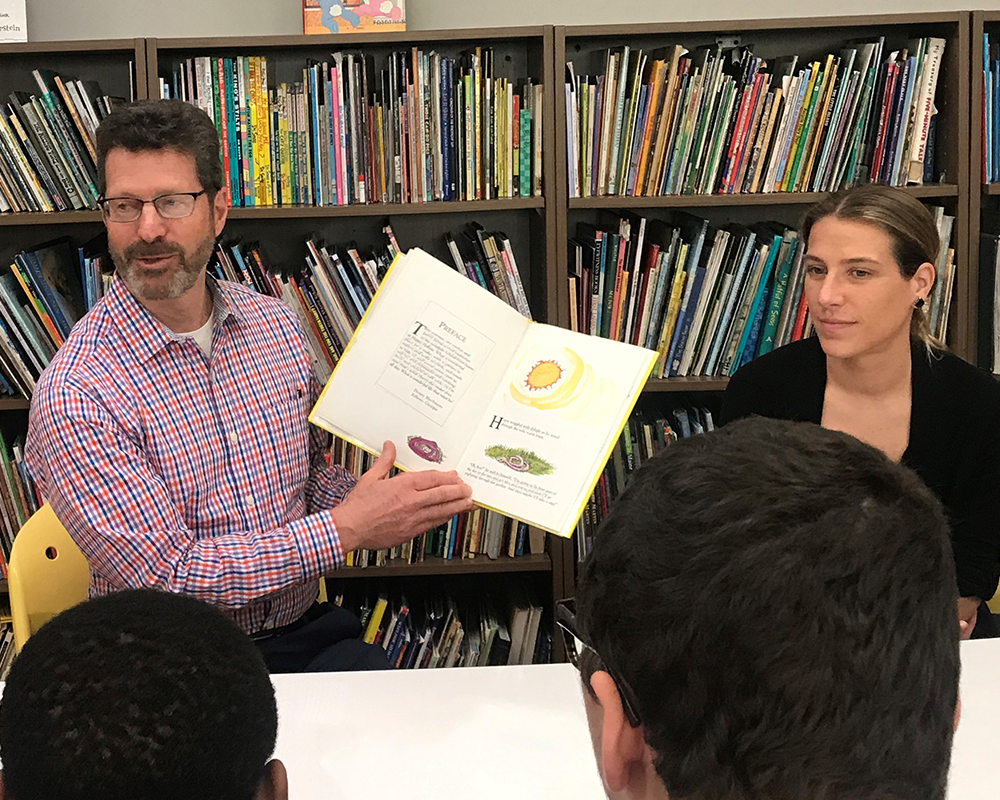 Craig Stabler and Kristen Kelly reading to students at Devereux Reading Week 2019