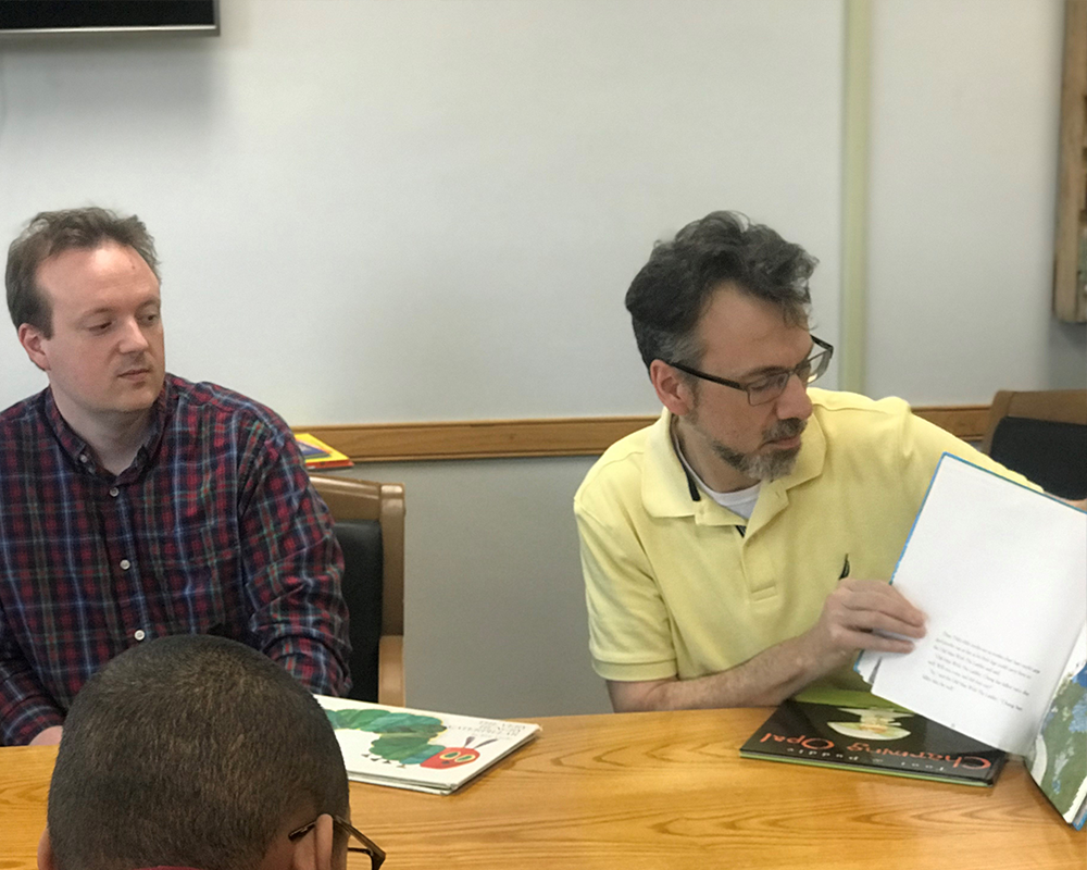 Taylor Kingsbury and Steve Lane reading to students at Devereux Annual Week 2019