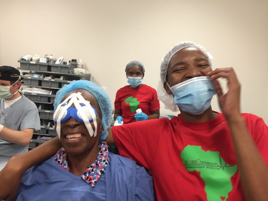 Patient after cataract surgery and on of The Luke Commission staff
