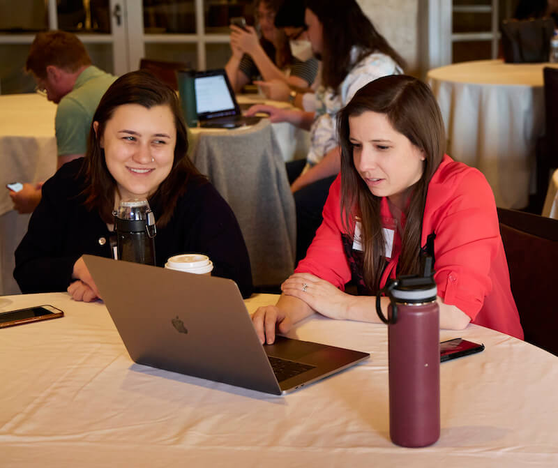 Two women working together